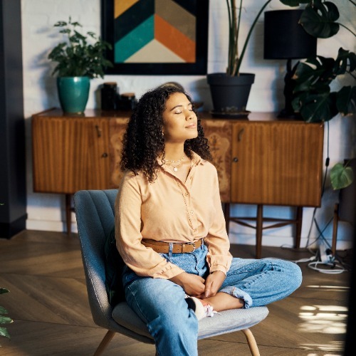 Woman Relaxing In Living Room