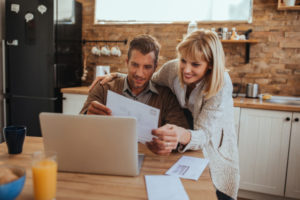 Couple Looking At Heating Bills